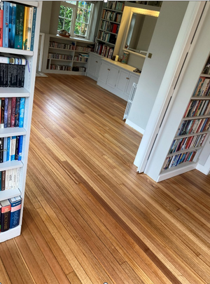 What can I use to cover my wooden floor after it has been finished?